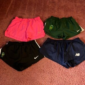Lot of 4 Mens running shorts. 3 Nike 1 new balance